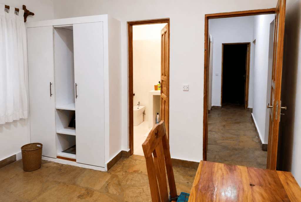 Accommodations villa verona building 2bedroom showing wardrobe toilet working table connecting room