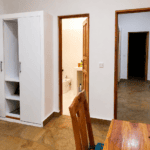 Accommodations villa verona building 2bedroom showing wardrobe toilet working table connecting room